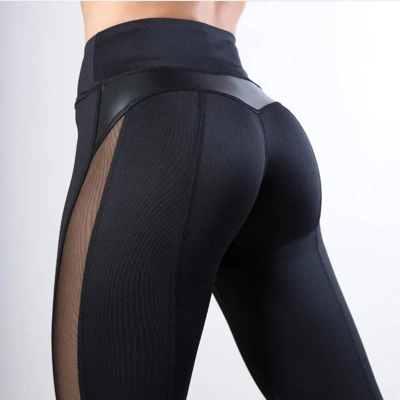 Black athletic leggings with sheer mesh side panels and a glossy waistband detail.