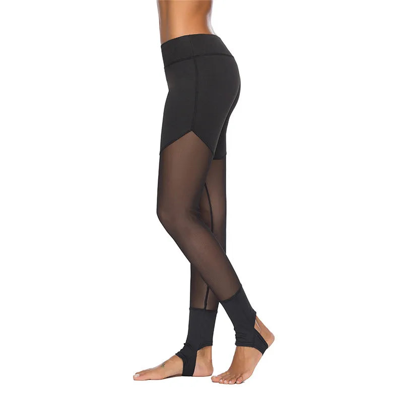 Athletic leggings with sheer mesh panels and stirrup-style foot straps.