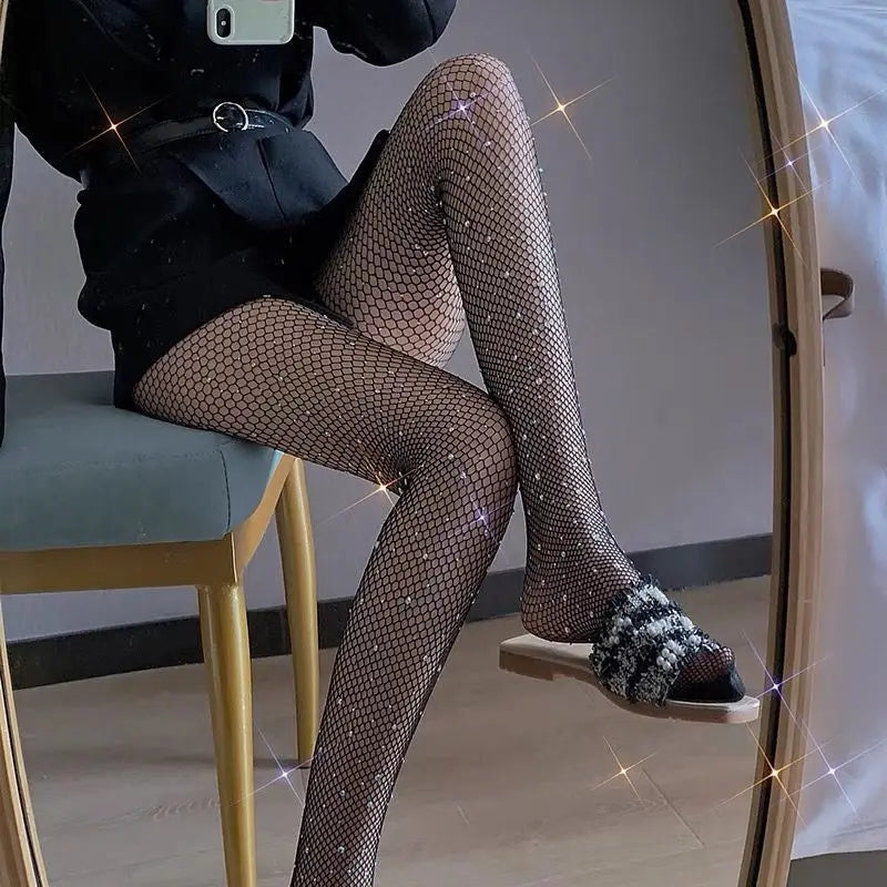 Sparkly fishnet stockings worn with fluffy open-toe slippers.