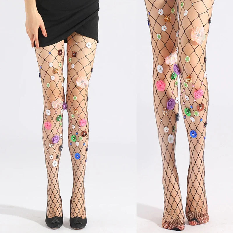 Fishnet stockings adorned with colorful floral appliqués.