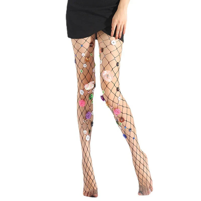 Fishnet stockings adorned with colorful floral appliqués.