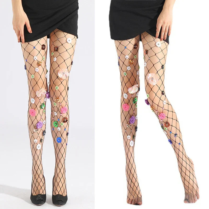 Fishnet stockings adorned with colorful floral appliqués and embellishments.