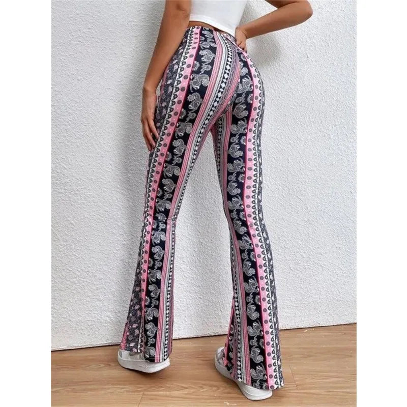 Patterned flared pants with vertical stripes and floral designs in black, white, and pink.