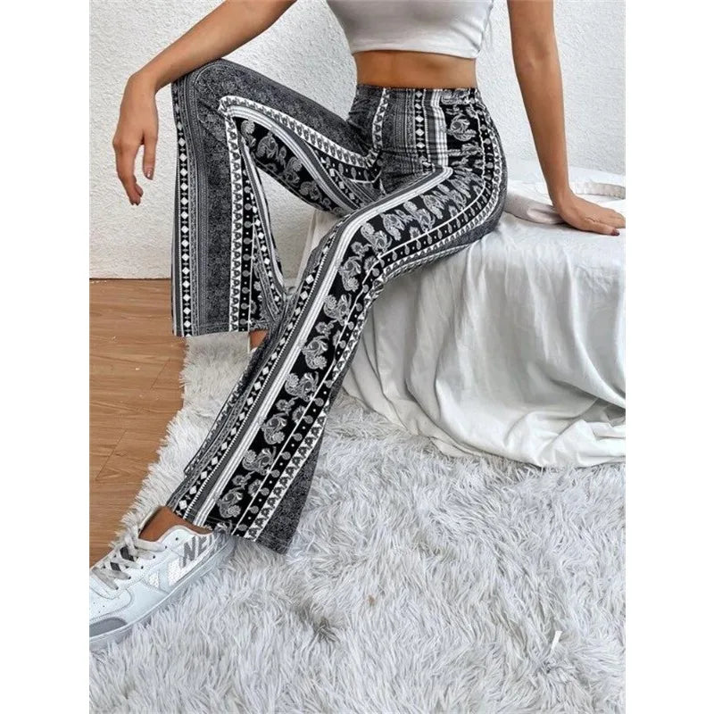 Patterned black and white pants with intricate floral and geometric designs.