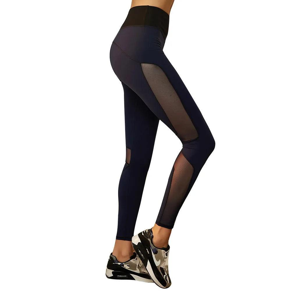 Black athletic leggings with sheer mesh panels and camouflage sneakers.