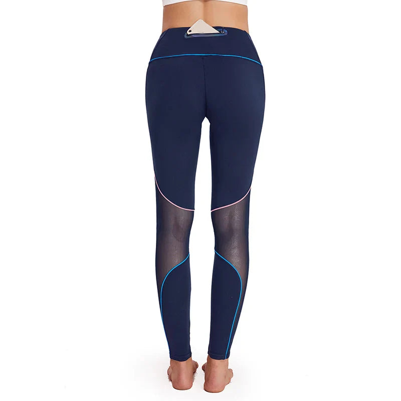 Navy blue athletic leggings with mesh inserts and light blue piping.