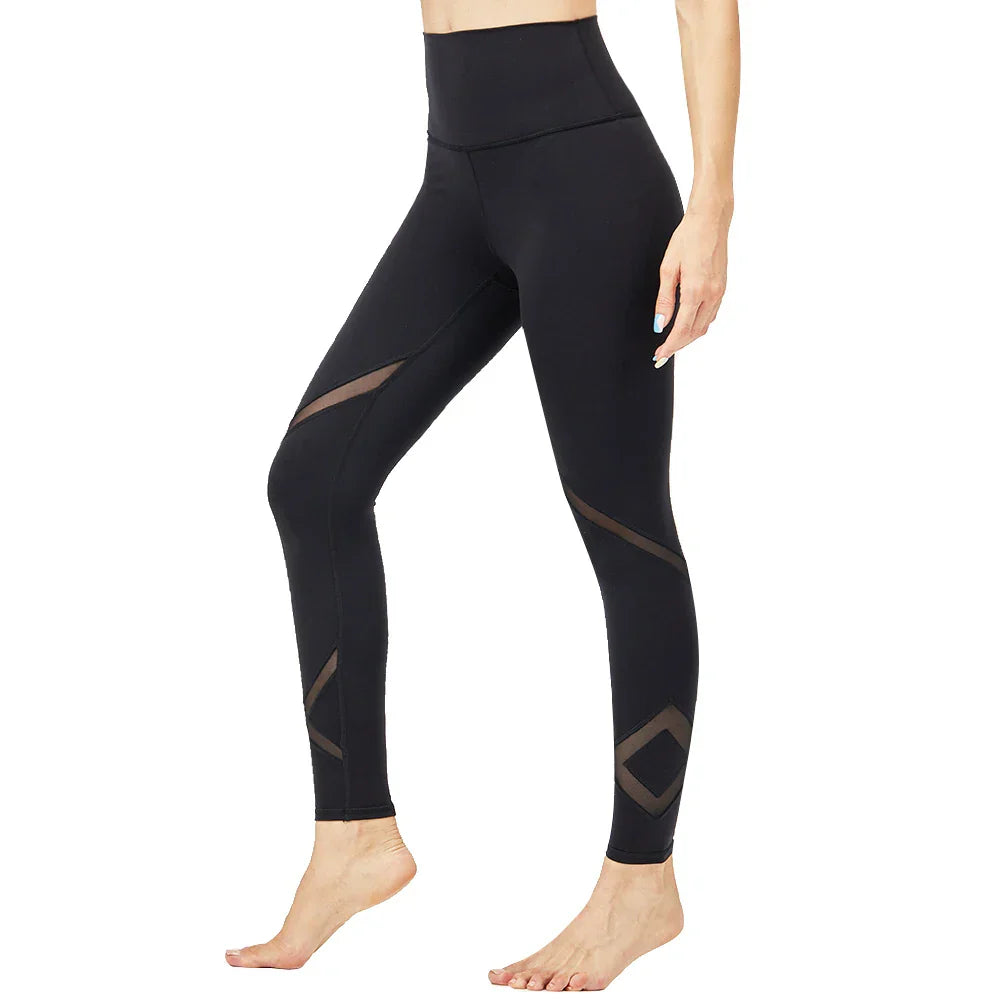 Black high-waisted yoga leggings with mesh cutout details.