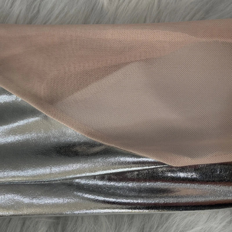 Fabric samples showing contrasting textures and colors, including beige canvas and shiny metallic material.