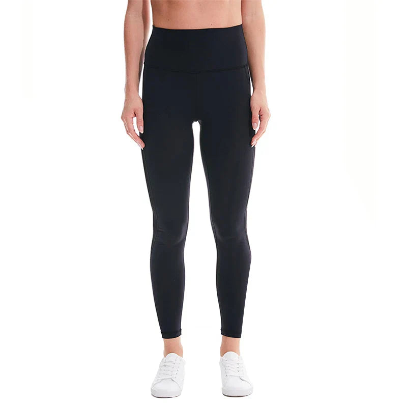 Black high-waisted leggings worn with white sneakers.