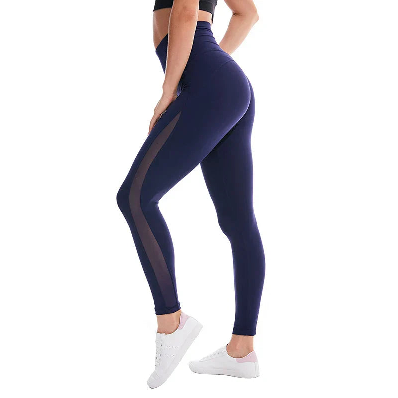 Navy blue athletic leggings with a sheer mesh panel along the side.