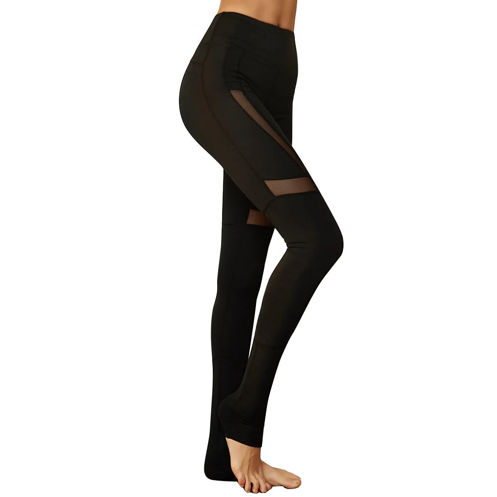 Black leggings with sheer mesh panels.