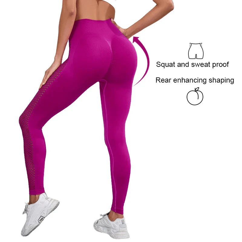 Bright magenta workout leggings with mesh side panels and shaping features.