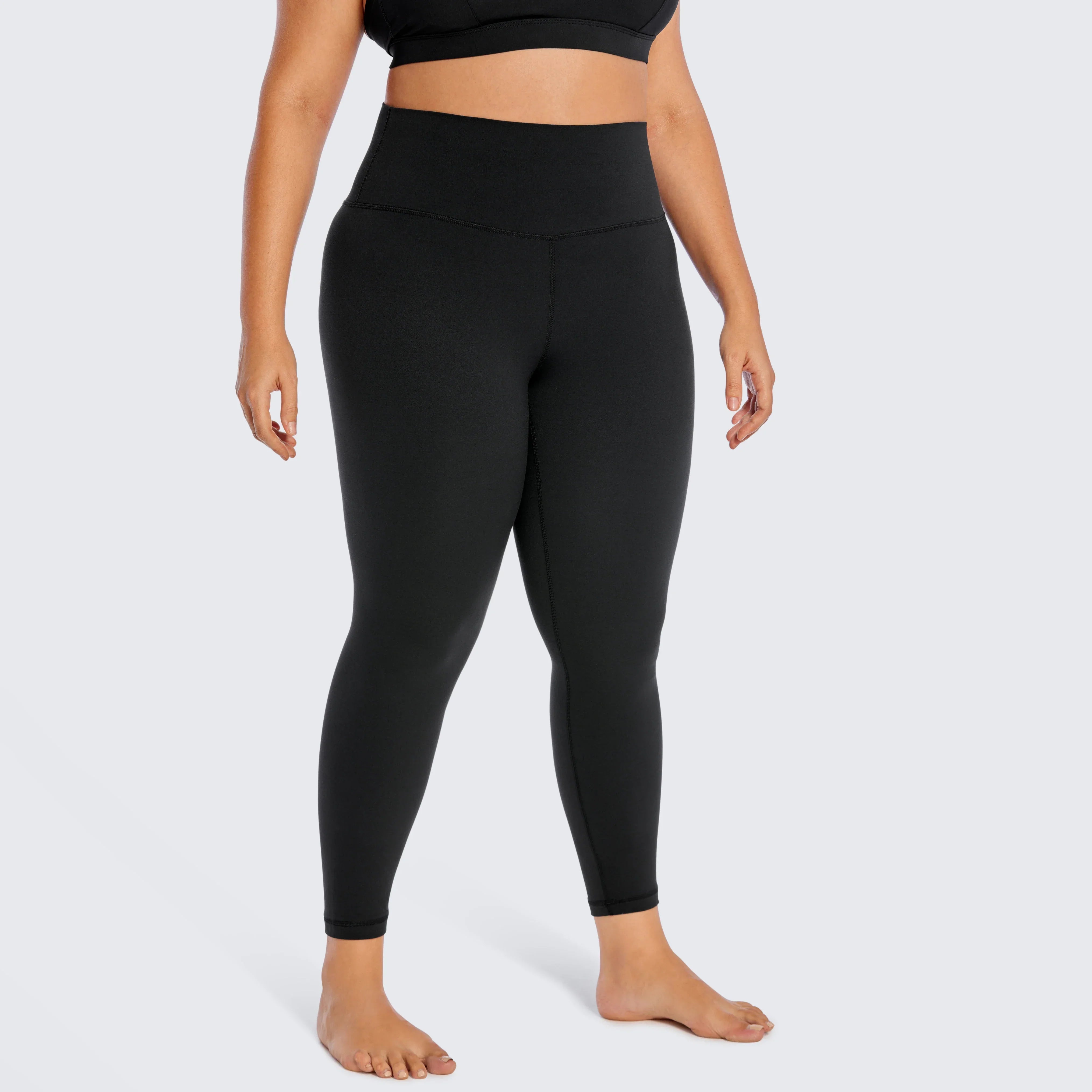 Black high-waisted athletic leggings worn on a person’s lower body.