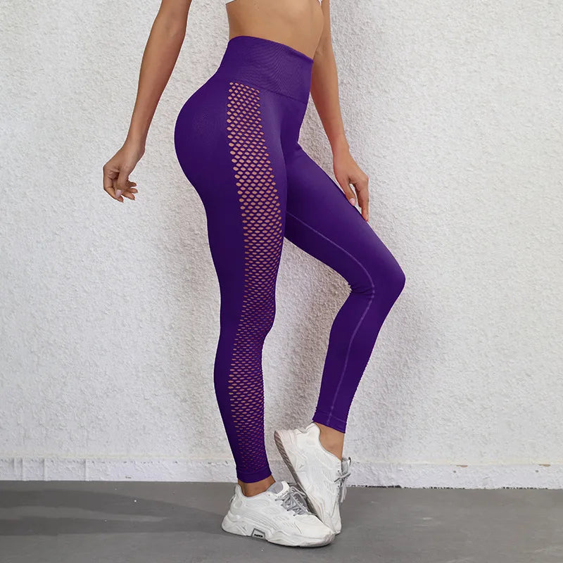 Purple athletic leggings with mesh side panels and a high waistband.