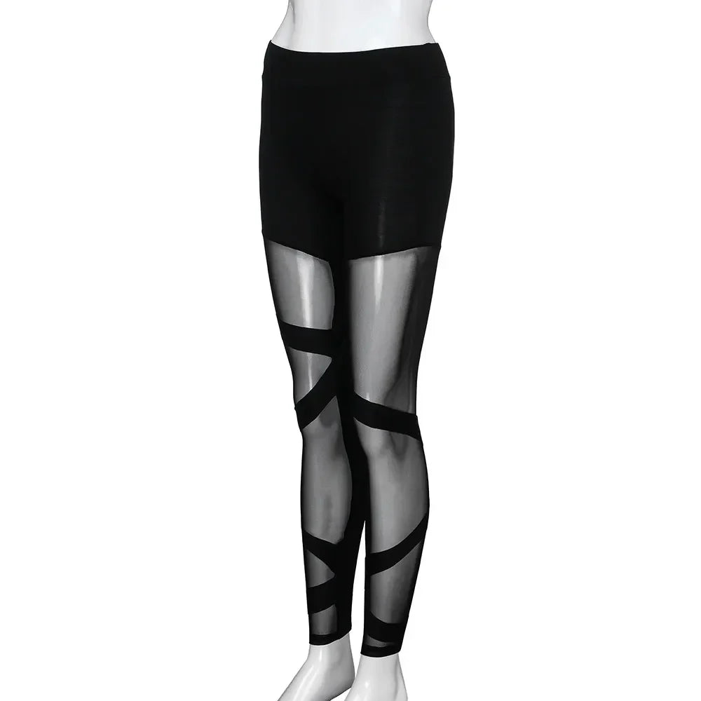 Black leggings with sheer mesh panels and crisscross straps on the legs.