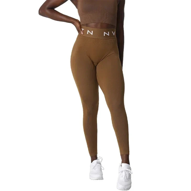 Brown high-waisted leggings with a wide elastic waistband featuring ’N NY’ text.