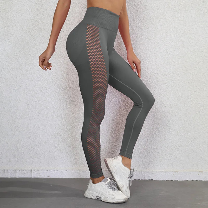 Gray athletic leggings with mesh side panels and a high waistband.